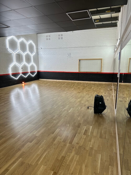 Inside Bristol Dance Centre - spacious studio with mirrors and wooden floor
